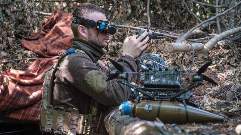 Ukrainian soldier pilots a drone in Kharkiv — illustrating the optical counter-UAS detection challenge at the front, June 2024