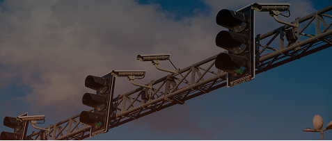 AI-powered traffic management system monitoring traffic signals and road intersections using smart surveillance cameras.
